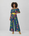 Blue Multi Print Pleated Jumpsuit - styled with yellow belt and heels, walking video